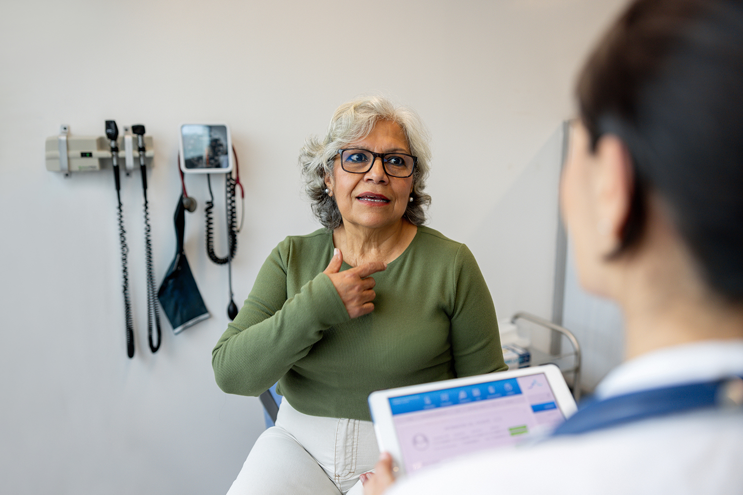 Patient speaking with her doctor about health numbers