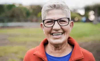 Smiling older woman outdoors