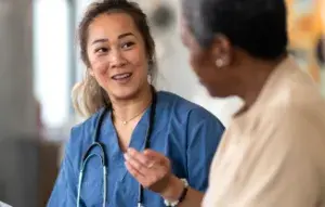 A doctor explaining something to her patient