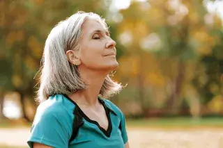 Senior outside breathing fresh air