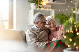A senior couple celebrating the holidays together.