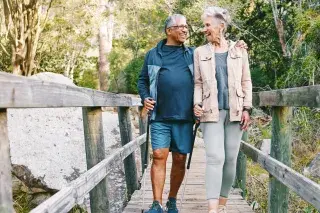 Senior couple walking together to stay healthier