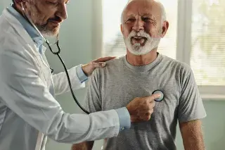 Patient gleefully allows doctor to listen to his heart