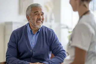 Patient consulting with medical staff about cancer prevention