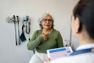 Patient speaking with her doctor about health numbers