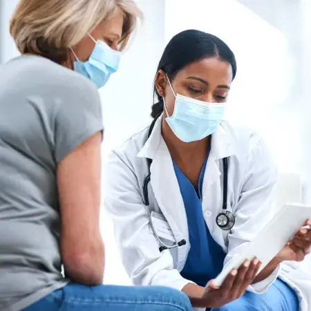 A doctor explaining something to her patient