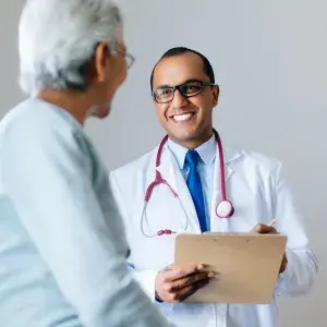 Doctor and patient smiling during an appointment